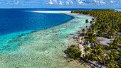 Aerial of a white sand beach in the Amaru atoll, Tuamotu Islands, French Polynesia, South Pacific, Pacific