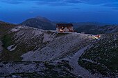 Mountain hut on top of mountains of Gran Sasso National Park at dusk, Campo Imperatore, Apennines, Abruzzo, Italy, Europe