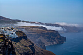 Fira on the cliffs overlooking the caldera, from Imerovigli, Santorini, the Cyclades, Aegean Sea, Greek Islands, Greece, Europe