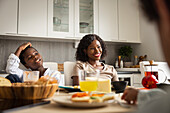 Mother and son eating breakfast