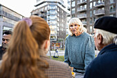 Neighbors meeting in courtyard