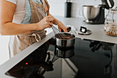 Woman in kitchen preparing food