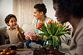 Family playing cards at home