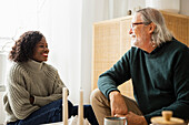 Man and woman talking at home