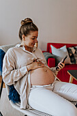 Pregnant woman using cell phone