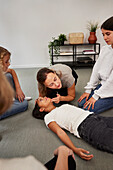 Teacher giving first aid training