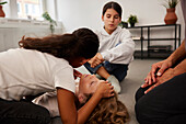 Teacher giving first aid training