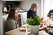 Family eating dinner at home together