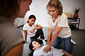 Teacher giving first aid training