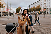 Smiling woman putting helmet on