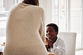 Mother and son sitting at table