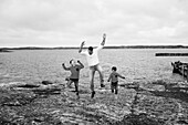 Father with sons at sea