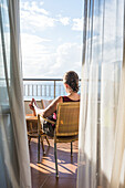Woman relaxing on balcony