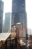 Girls looking at skyscrapers