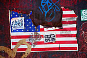 Graffiti and American flag on wall