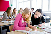 Teenage girls learning in classroom