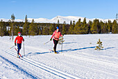 Mother and son cross-country skiing