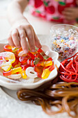 Girl making candy jewelry