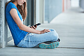 Teenager girl using cell phone