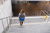 Woman walking down stairs