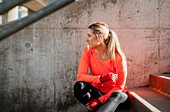 Woman sitting on stairs