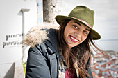 Portrait of young woman at docks