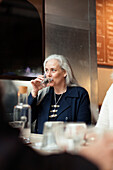 Mature woman drinking water