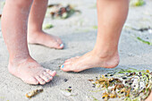 Kids feet on sand