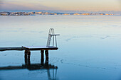 Jetty with swim ladder at sea