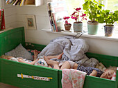 Two girls sleeping in bed