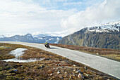 Biker on mountain road