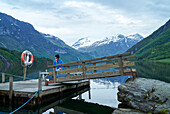 Man at lake talking via cell phone