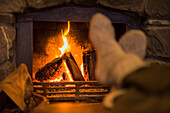 Feet near fireplace