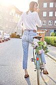 Woman on bicycle looking away