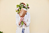 Woman holding bouquet of flowers