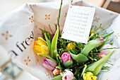 Close up of flower bouquet and note