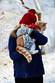 Girl hugging cat