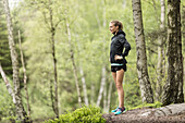 Woman standing in forest