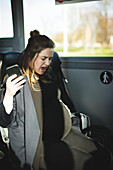 Pregnant woman traveling by bus