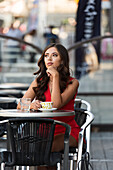 Young woman having coffee