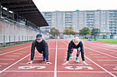 Man and woman on running track