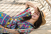 Woman lying on hammock