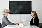 Businesswomen sitting in conference room