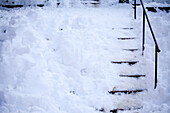 Stairs covered with snow