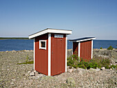 Wooden outhouses at sea