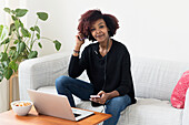 Woman sitting on sofa