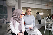 Two women working in office