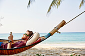 Man on hammock reading