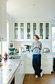 Young woman drinking coffee at home