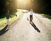 Couple walking dogs